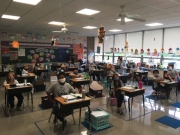 Classrooms were reconfigured to allow more space between fewer desks.