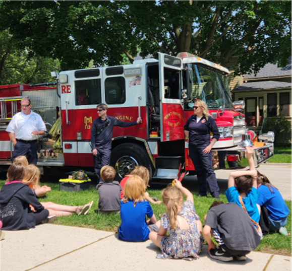 History campers listen to firefighters